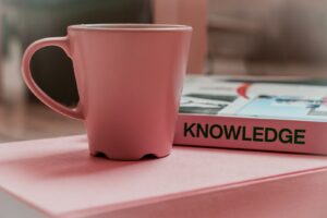 knowledge mug and book